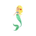 Blond mermaid girl with long fish tail and shell bra.