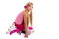 Blond pigtails roller skate girl on her knees happy