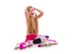 Blond pigtails roller skate girl sitting happy Royalty Free Stock Photo