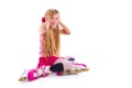 Blond pigtails roller skate girl sitting happy