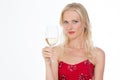 Blond pretty girl with a glass of white wine on closeup