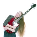 Blond teen girl and bass guitar against white background in studio Royalty Free Stock Photo