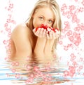 Blond with red and white rose petals and flowers i Royalty Free Stock Photo
