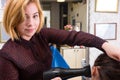 Blond Stylist Drying Hair of Woman with Blow Dryer Royalty Free Stock Photo