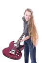 Blond teen girl and bass guitar against white background in stud Royalty Free Stock Photo