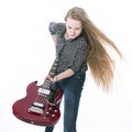 Blond teen girl and bass guitar against white background in studio Royalty Free Stock Photo