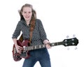Blond teen girl with electric bass guitar against white background Royalty Free Stock Photo
