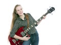 Blond teen girl with electric bass guitar against white background Royalty Free Stock Photo