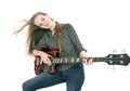 Blond teen girl with electric bass guitar against white background Royalty Free Stock Photo