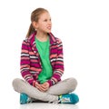 Blond Teen Girl Sitting Legs Crossed And Looking Away Royalty Free Stock Photo