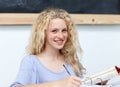 Blond teen girl studying in the library Royalty Free Stock Photo