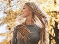 Blond teenage girl flicking her hair