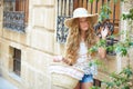 Blond tourist girl in mediterranean old town