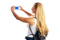 Blond tourist girl taking photos with smartphone