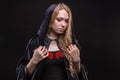 Blond woman in black hood Royalty Free Stock Photo