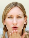 Blond woman blowing kiss Royalty Free Stock Photo