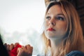 Blond woman in blue dress in cafe Royalty Free Stock Photo