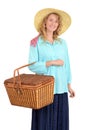Blond woman carrying picnic basket Royalty Free Stock Photo