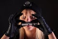 Blond woman cat burglar using a spy camera Royalty Free Stock Photo