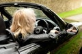 Blond woman driving car Royalty Free Stock Photo