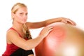 Blond woman exercising with a pilates ball Royalty Free Stock Photo