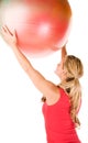 Blond woman exercising with a pilates ball Royalty Free Stock Photo