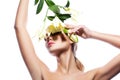 Blond woman with fresh clean skin and white lily flower isolated