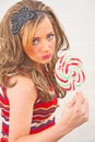 Blond woman with a giant lolly