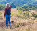 Blond woman hiking in the great African outdoors Royalty Free Stock Photo