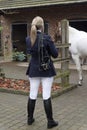 Bridle over shoulder of a horsewoman Royalty Free Stock Photo