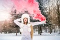 Blond woman with long hair holding smoke bomb Royalty Free Stock Photo