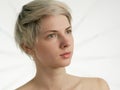 Blond woman looking at side on white background Royalty Free Stock Photo