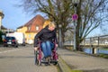 Blond woman manoeuvring a wheelchair Royalty Free Stock Photo