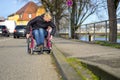 Blond woman manoeuvring a wheelchair Royalty Free Stock Photo