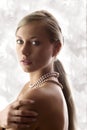 Blond woman with pearl Royalty Free Stock Photo