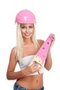 Blond woman with pink hard hat Royalty Free Stock Photo