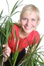Blond woman with plant