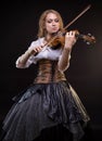 Blond woman playing the fiddle Royalty Free Stock Photo