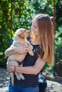 Blond woman playing with a white Labrador puppy Royalty Free Stock Photo