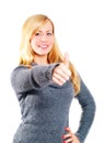 Blond woman pointing ok sign over white