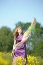 Blond woman in a purple dress Royalty Free Stock Photo