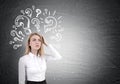 Blond woman and question marks on chalkboard Royalty Free Stock Photo