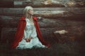 Blond woman with red hooded cloak