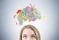 Blond woman s head and brain with gears
