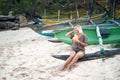 Blond Woman Sit on Beach Drink Coconut Juice Royalty Free Stock Photo