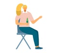 Blond woman sitting holding beer bottle, talking, casual clothing. Socializing adult in relaxed posture, drinking