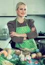 Blond woman slicing pepper