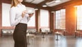 Blond woman standing in cafe