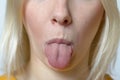 Blond Woman Sticking her Tongue Out Royalty Free Stock Photo