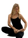 Blond woman streches, preparing for Yoga exercise